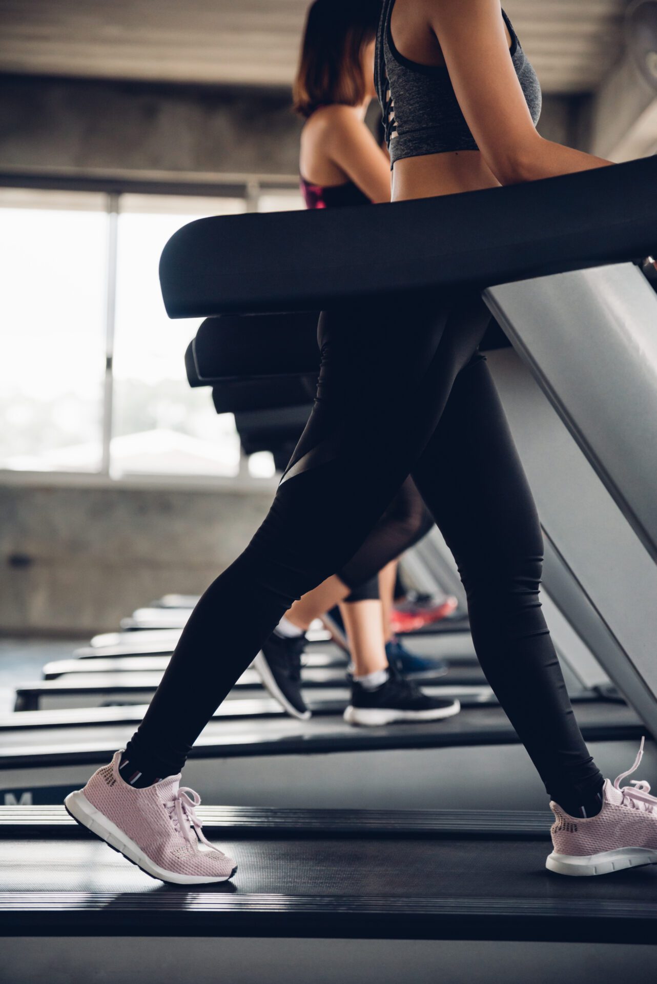 Close,Up,Shoe,And,Legs.,Asian,Women,Running,In,A Gym in apartments